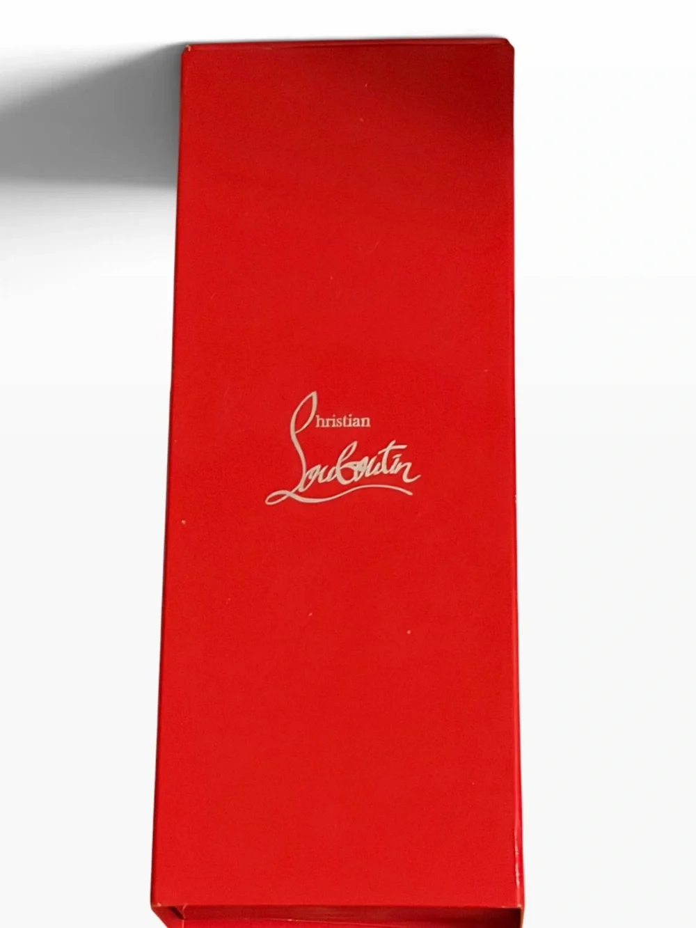 Christian Louboutin Black Spike-Detail Lipstick Holder with red lipstick